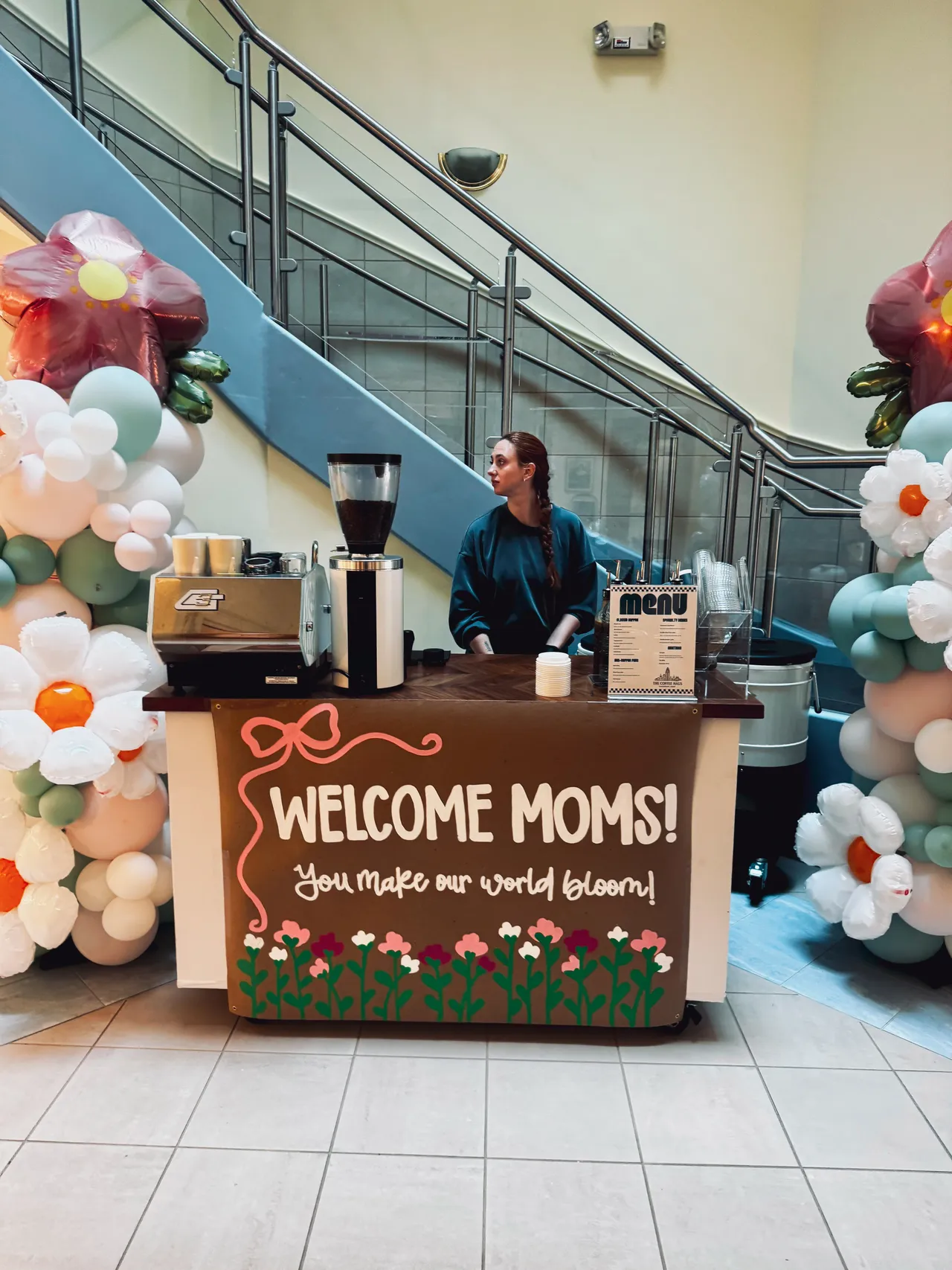 The Coffee Haus cart at a community Mother's Day event with balloon decor