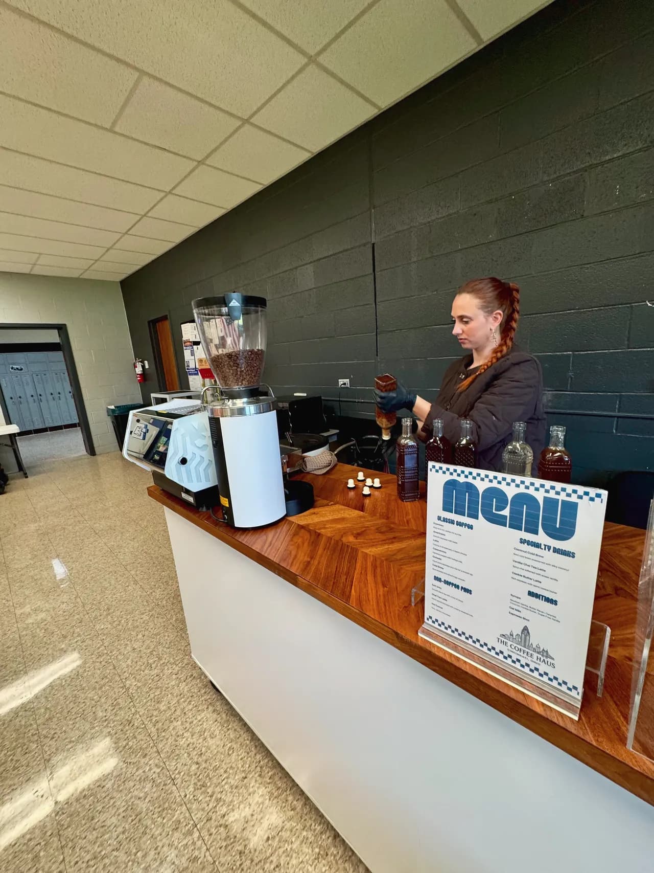 Printed drink menu displayed on The Coffee Haus coffee cart at an event